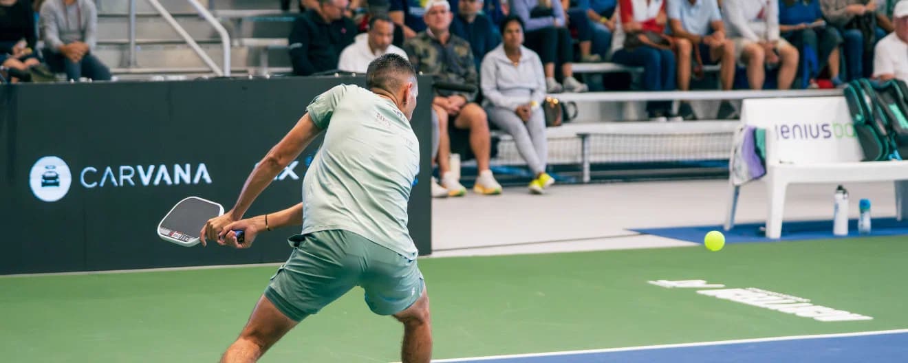 Gabe Joseph hitting a pickleball backhand.