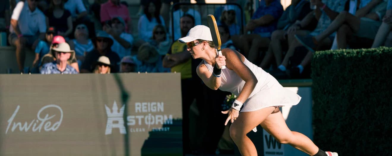 Mari Humberg hitting a pickleball forehand.