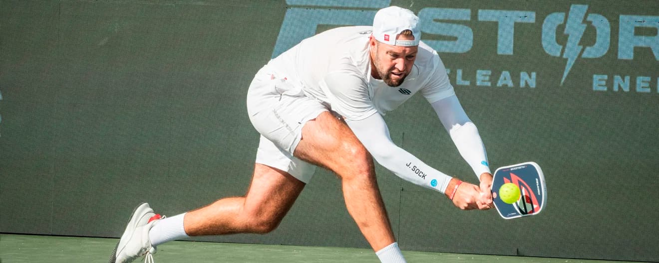 Jack Sock hitting a pickleball backhand.